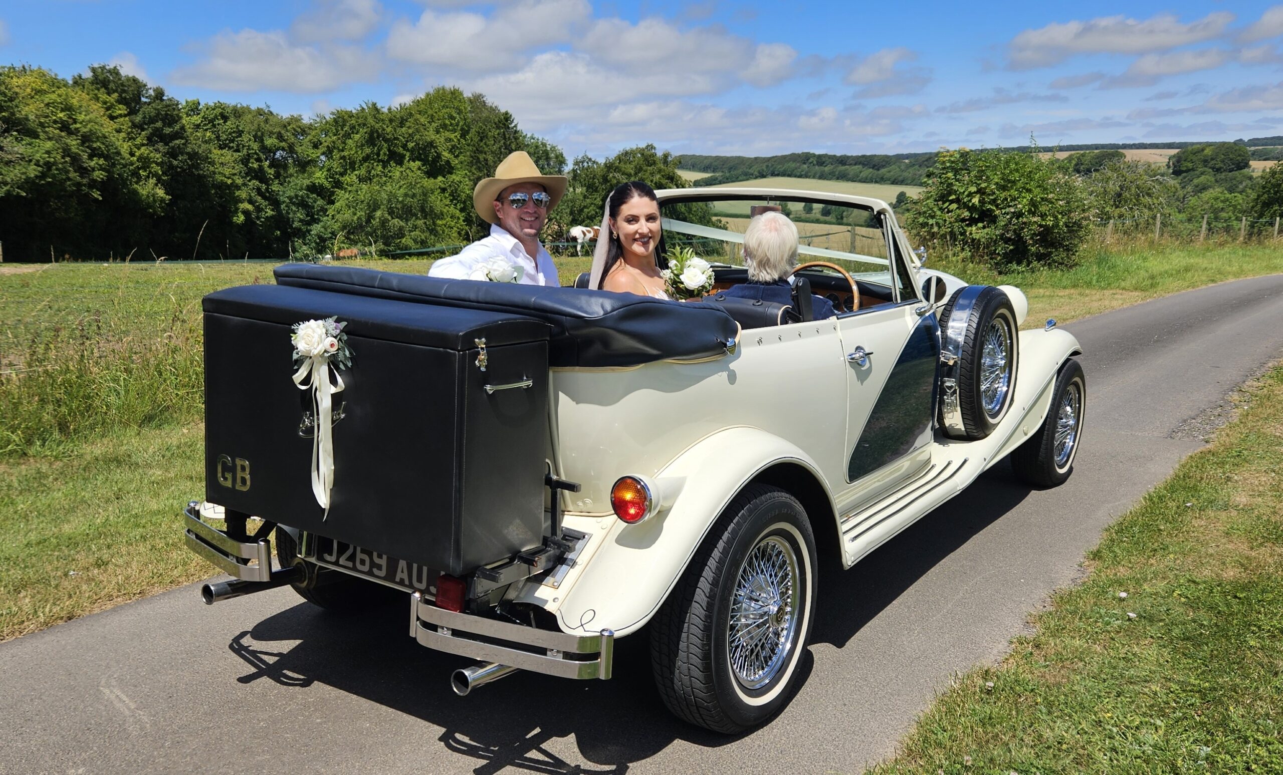 Happy Bride and Groom in Wedding Car